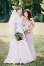 Happy girls Bride and bridesmaid with bouquets