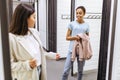 Happy girls buying clothes in clothing store Royalty Free Stock Photo