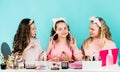 Happy girls doing makeup together. Sisterhood happiness. Cosmetics shop. Apply powder. Cream base tone. Prevent acne Royalty Free Stock Photo