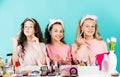 Happy girls doing makeup together. Sisterhood happiness. Cosmetics shop. Control oil. Apply lipstick. Prevent acne. Kids Royalty Free Stock Photo