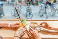 happy girls having lunch in a cafe, drinking coffe and talking. Friendship and lifestyle concept Royalty Free Stock Photo