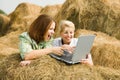 Happy girls with laptop Royalty Free Stock Photo