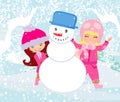 Happy girls make a snowman Royalty Free Stock Photo