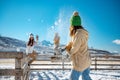 Happy girls plays in snowballs at first snow Royalty Free Stock Photo