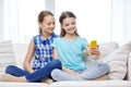 Happy girls with smartphone taking selfie at home Royalty Free Stock Photo