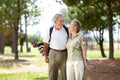 Happy, golf or senior couple on course in fitness workout, exercise or round together on grass field. Love, healthy Royalty Free Stock Photo