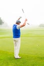 Happy golfer cheering on putting green Royalty Free Stock Photo