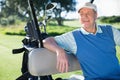 Happy golfer driving his golf buggy Royalty Free Stock Photo