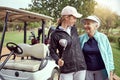 Happy golfers. a senior woman and her adult daughter enjoying a day on the golf course. Royalty Free Stock Photo