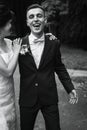 Happy gorgeous bride and stylish groom laughing and having fun. emotional moment of beautiful wedding couple. black white photo Royalty Free Stock Photo