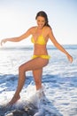 Happy gorgeous woman in yellow bikini having fun in the sea Royalty Free Stock Photo