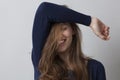 Happy gorgeous young woman hiding her face with hair Royalty Free Stock Photo