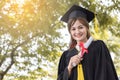 Happy graduate showing certificated in hand