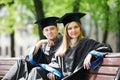 Happy graduate students outdoors Royalty Free Stock Photo
