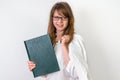 Happy graduate woman with her dissertation work on white Royalty Free Stock Photo