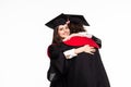 Happy graduated young students couple hugging isolated on white background Royalty Free Stock Photo