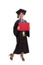 Happy graduating female student with a red placard, full body po Royalty Free Stock Photo