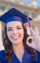 Happy Graduating Mixed Race Woman In Cap and Gown Ok Sign