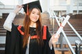 Happy graduation day for a young woman very beautiful with graduation cap smile large in front of the Camera posing Royalty Free Stock Photo