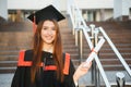 Happy graduation day for a young woman very beautiful with graduation cap smile large in front of the Camera posing Royalty Free Stock Photo