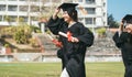 Happy graduation students  holding diploma and running on the stadium at school Royalty Free Stock Photo
