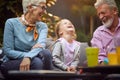 Happy granddaughter laughing with her grandparents.Happy childhood,family and relationships