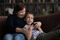 Happy granddaughter and mature 60s grandmother enjoying leisure time together Royalty Free Stock Photo