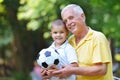 Happy grandfather and child in park Royalty Free Stock Photo