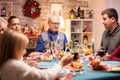 Happy grandfather at christmas family dinner Royalty Free Stock Photo