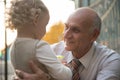 Happy grandfather with granddaughter