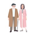 Happy grandfather and granddaughter dressed in stylish outerwear standing together. Elegant elderly man and teenage girl