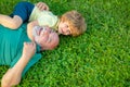 Happy grandfather and grandson relaxing together. Child with Grandfather dreams in summer in nature. Happy family father Royalty Free Stock Photo