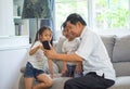 happy Grandfather with kids using smartphone Sharing headphone together for listening to music and enjoying ,dancing on sofa or Royalty Free Stock Photo