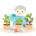 Happy grandfather watering lettuce