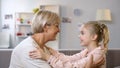 Happy grandma and granddaughter embracing and looking at each other togetherness Royalty Free Stock Photo