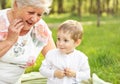 Happy grandma with grandson embracing. Grandmother hugging boy. Royalty Free Stock Photo