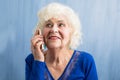 Happy grandma talking on smartphone Royalty Free Stock Photo