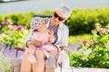 Happy grandmother and baby granddaughter at garden Royalty Free Stock Photo