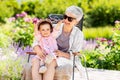 Happy grandmother and baby granddaughter at garden Royalty Free Stock Photo