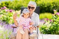 Happy grandmother and baby granddaughter at garden Royalty Free Stock Photo