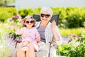 Happy grandmother and baby granddaughter at garden Royalty Free Stock Photo