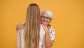 Happy grandmother embracing her grown up granddaughter. Family bonding concept Royalty Free Stock Photo