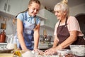 Happy grandmother feeling proud of her granddaughter culinary skills Royalty Free Stock Photo