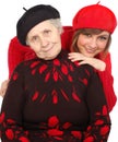 Happy grandmother and granddaughter with berets