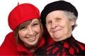 Happy grandmother and granddaughter with berets