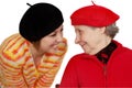 Happy grandmother and granddaughter with berets