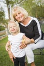 Happy Grandmother and Granddaughter Playing At The Park Royalty Free Stock Photo