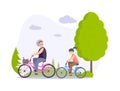 Happy grandmother and granddaughter riding bikes at summer forest park. Ride on bicycles Royalty Free Stock Photo