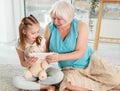 Happy grandmother with granddaughter using tablet Royalty Free Stock Photo