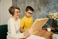 Happy grandmother helping grandson study math at home Royalty Free Stock Photo